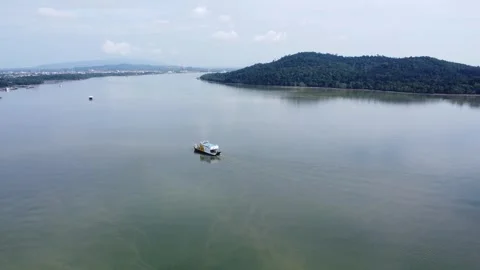 Ferries that take passengers to the port pass through the Kalimantan Sea Stock Footage 264795756