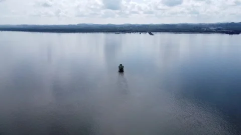 Ferries that take passengers to the port pass through the Kalimantan Sea Stock-Footage 264796705