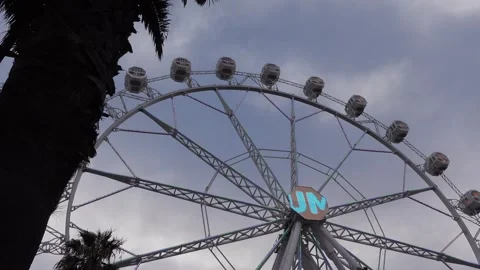 Ferries wheel moving, overcast sky Stock Footage 294999933
