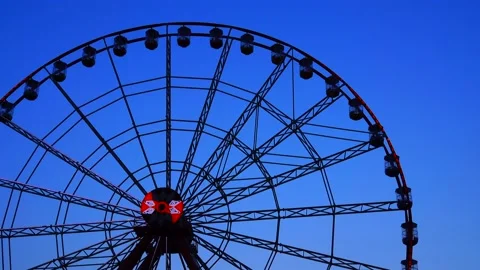 Ferris wheel against the background of the evening sky Stock Footage 94253329