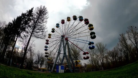 Ferris wheel against the background of rapidly moving clouds Stock Footage 190106408