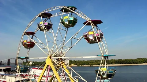 Ferris wheel against the background of the river Video stock 95546015