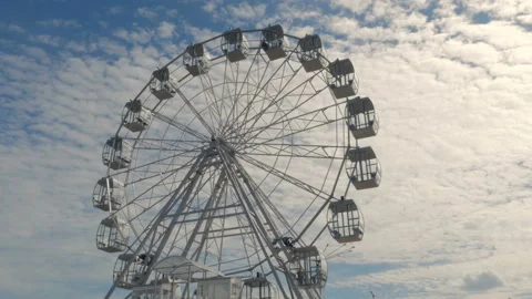Ferris wheel against the blue sky Stock Footage 88311306