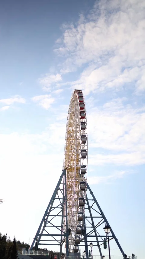 Ferris wheel against bright sky Stock Footage 331200674