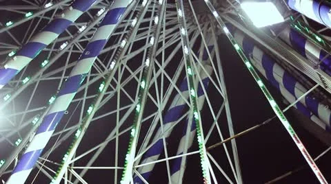 Ferris wheel in amusement park at night Stock Footage
