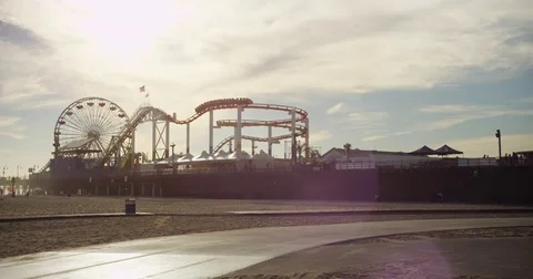 Ferris Wheel and roller coaster can be seen at Santa Monica Pier. Stock Footage 72991566