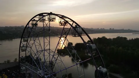 Ferris wheel and sunset drone view Stock Footage