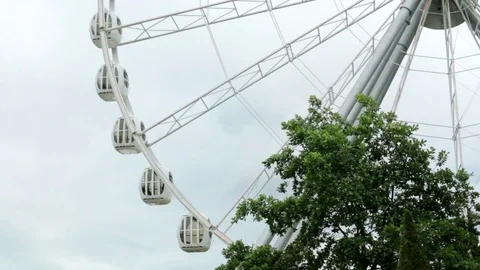 Ferris wheel attraction in slow motion rotating circle Park Stock Footage 79216117