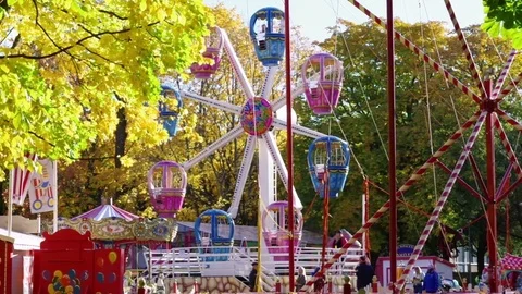 Ferris wheel. Autumn leaf fall. Stock Footage 83008575