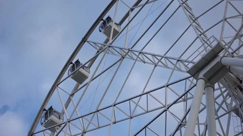 Ferris wheel on a background of blue sky and clouds. Entertainment park. Close 動画素材 194383432