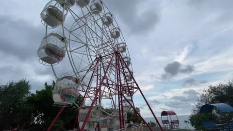 Ferris Wheel by the Beach on Cloudy Sky. Stock Footage 309279795