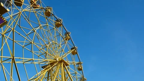 Ferris wheel on a blue sky background Stock Footage 274747249
