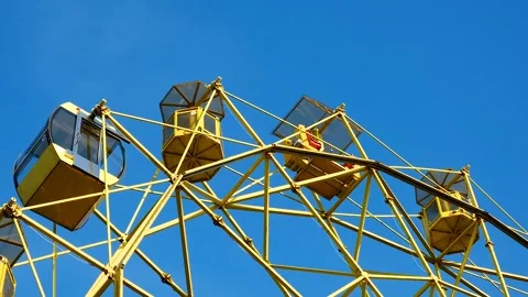 Ferris wheel on a blue sky background Stock Footage 274747250