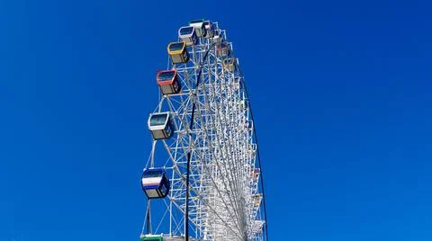 Ferris wheel on a blue sky background Stock Photos