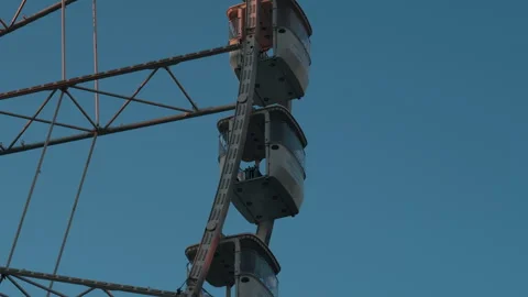 Ferris Wheel Cabins Moving at Sunset - Close-up Stock Footage 321623102