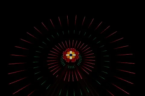 Ferris wheel circle shape red illumination night time carnival festive enviro Foto stock