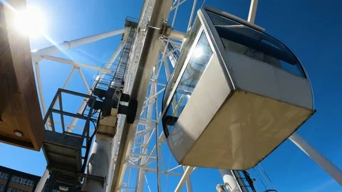 Ferris wheel close up, bottom view of the mechanisms and cabins Stock Footage 194855983