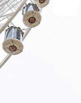 Ferris wheel close-up view from bottom to top on a background of a light sky Stock Photos