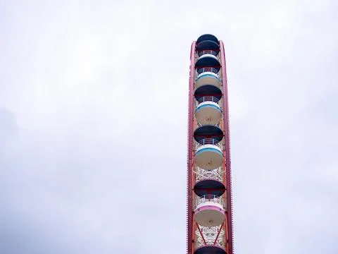 Ferris wheel on a cloudy day. Cloudy sky. Ferris wheel in an amusement park.. Stock Photos