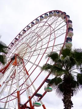 Ferris wheel on a cloudy day. Cloudy sky. Ferris wheel in an amusement park.. Stock Photos