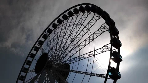 A ferris wheel with cloudy sky Stock Footage 146642251