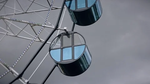 Ferris wheel in cloudy weather close up Stock Footage 77560731