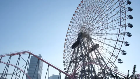Ferris wheel Cosmo Clock 21 in Cosmo World amusement park, Yokohama, Japan Video stock 242223659