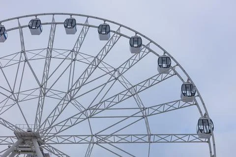 Ferris wheel with empty cabins against the sky Stock Photos