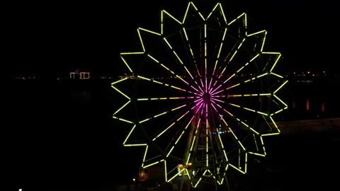 Ferris Wheel Flashes Neon Lights in Night Darkness. Park. Promenade. Big City Stock Footage 164651385