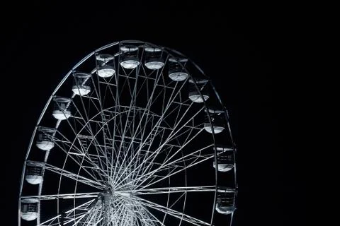 Ferris wheel - giant observation wheel illuminated against night sky Stock Photos