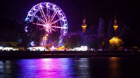 The Ferris wheel glows at night. Stock Footage 78356200
