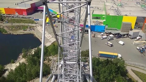 On the Ferris wheel goes down, sunny day Stock Footage 91626264