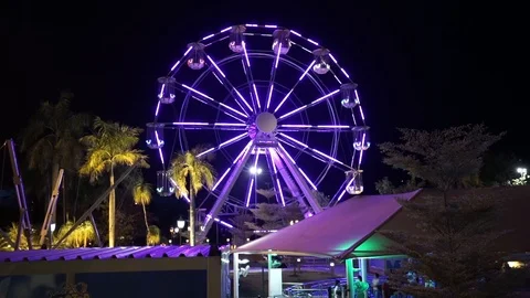 Ferris wheel lights changing colors by night Video stock 106017739
