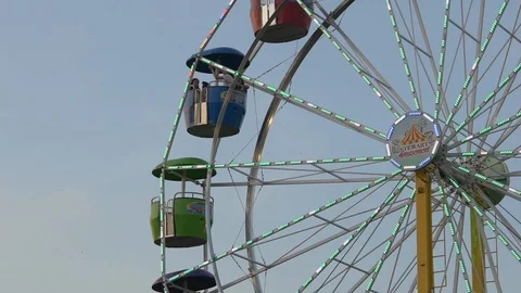 Ferris Wheel Medium Shot Turns During Early Evening Carnival Stock Footage 90428360