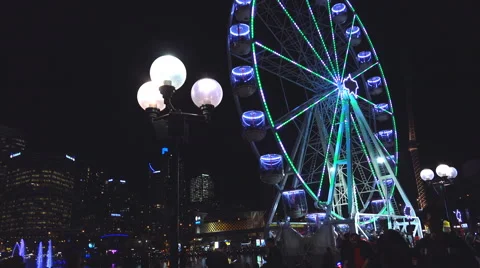 Ferris wheel at night by harbor Video stock 54547356