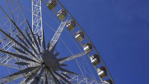 Ferris Wheel Over Blue Sky background Stock Footage 238975880