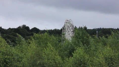 Ferris wheel over looking trees Stock Footage 93893258