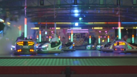 Ferris wheel. People having fun riding roller coaster at the amusement park Stock Footage 238031614