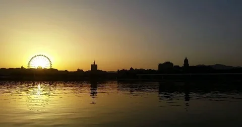 Ferris wheel on a pier at sunset fast camera Stock Footage 74725317