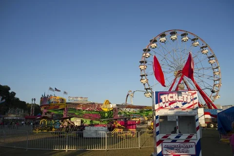 Ferris wheel with red flags in the wind Stock Footage 89421601