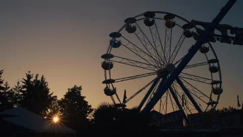 Ferris wheel ride at theme park at sunset Stock Footage 115244235