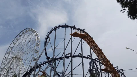 Ferris wheel. Roller coaster. Amusement park. 動画素材 116278272