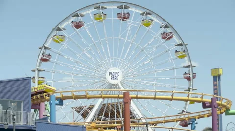 Ferris Wheel with Roller Coaster - Super Slow Motion 240FPS Stock Footage 63407890