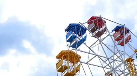 Ferris wheel rotating with sky background Stock Footage 64701891