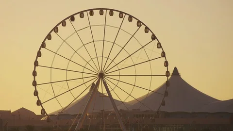 Ferris Wheel rotating at sunset Stock Footage 86605414