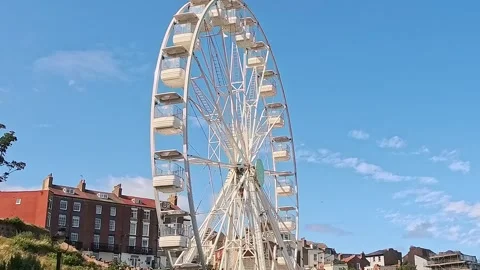 Ferris wheel on the seafront. Panning shot 스톡 동영상 313564053