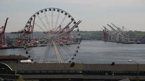 Ferris wheel in Seattle with Freight harbor in background 1 Stock Footage 39174587