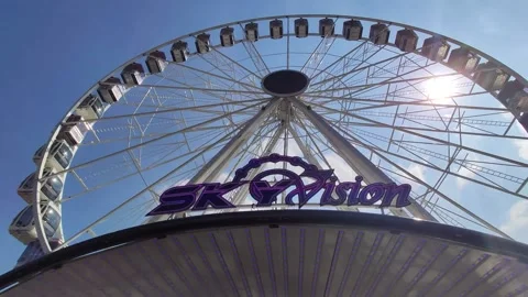 Ferris Wheel Sky Vision camera panning on a beautiful day Stock Footage 184644173