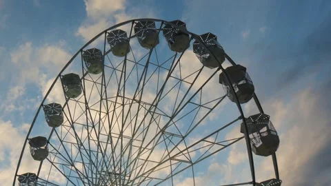 Ferris Wheel Spinning Against the Background of the Evening Sky Stock Footage 244465743