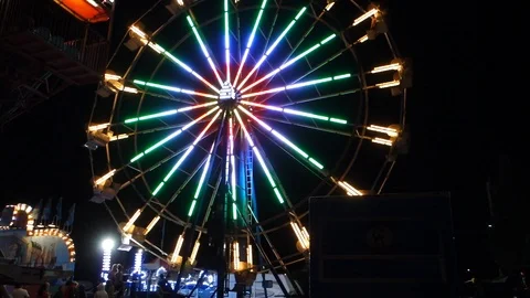 Ferris Wheel Spinning Quickly At State or County Fair Stock Footage 94217173